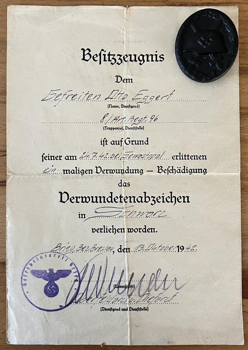 GERMAN BLACK WOUND BADGE WITH AWARD DOCUMENT( RUSSIAN FRONT ).