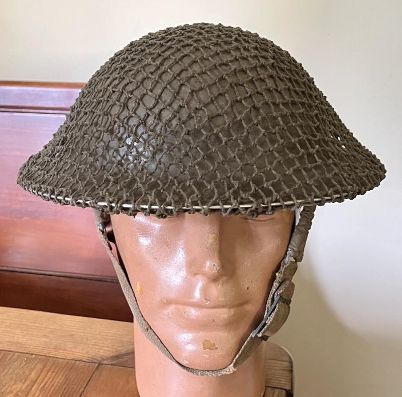EARLY WW2 BRITISH TOMMY HELMET WITH NET & NAMED